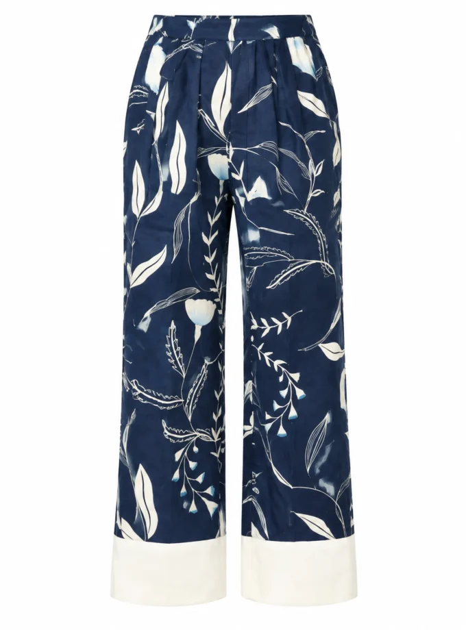 Arlette blue forest print straight fit pant with white contrast hem shown alone on an invisible mannequin