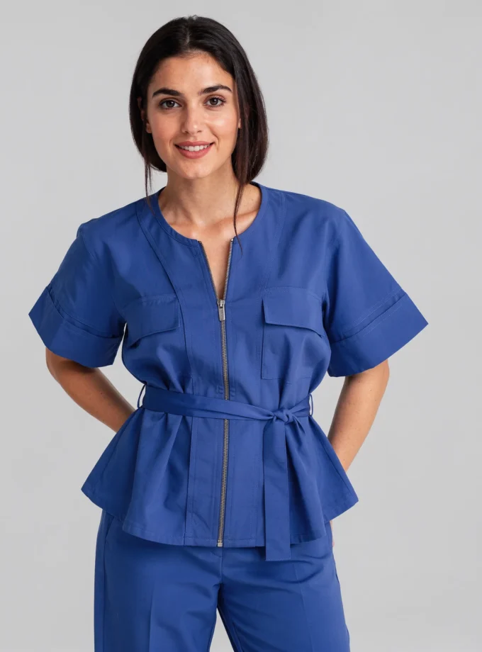 Bliss — model wearing the cobalt blue cotton zipper shirt with a fabric tie up and the cobalt blue straight fit pant