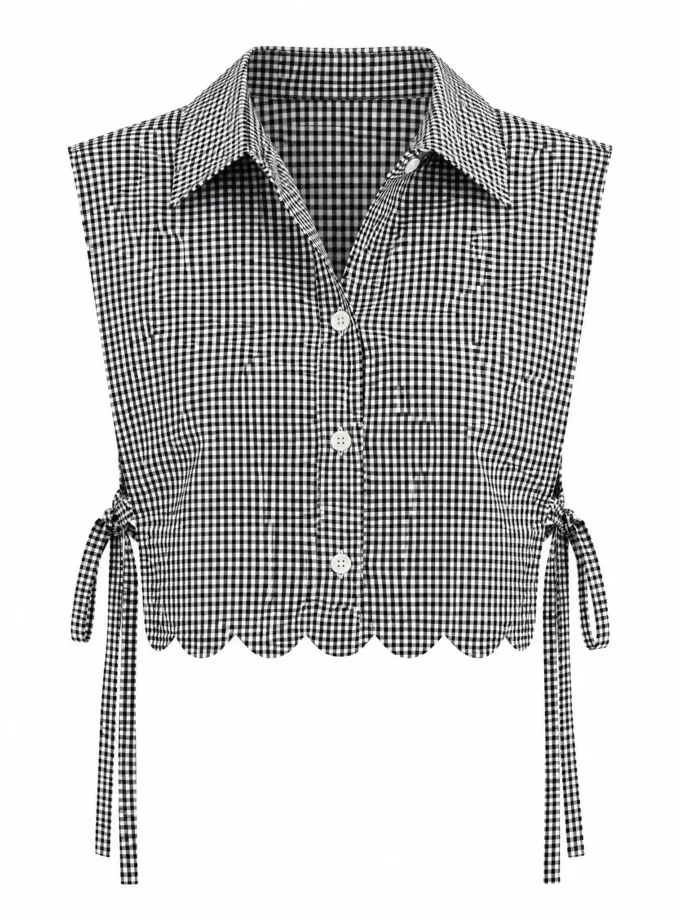 Breeze black and white houndstooth print bib with side tie up shown alone on an invisible mannequin