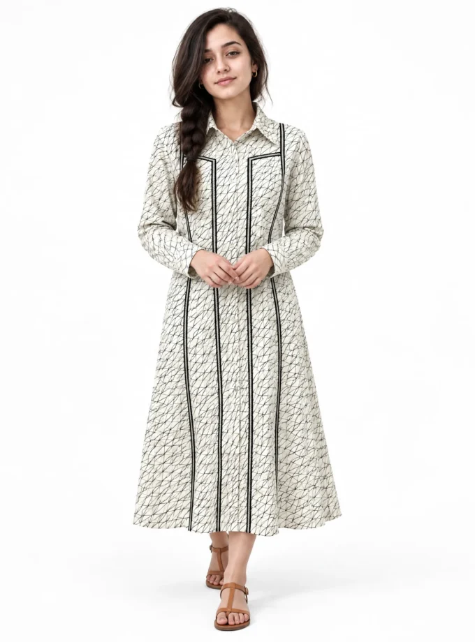 Butter — model wearing the geo print cotton pleated front midi dress with black lace edging