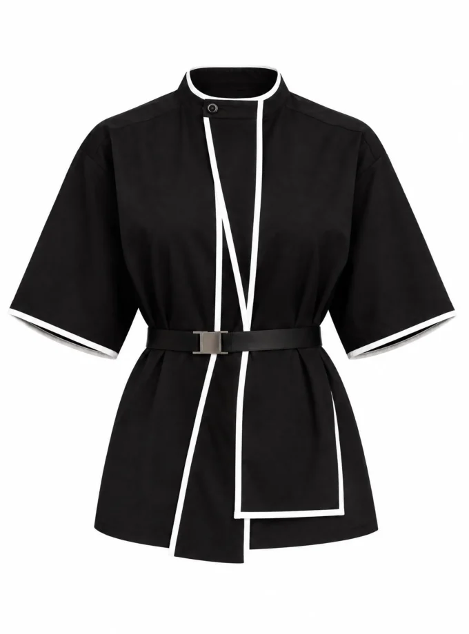 Celine black cotton collar top with white piped placket and hip overlay panel shown alone on an invisible mannequin