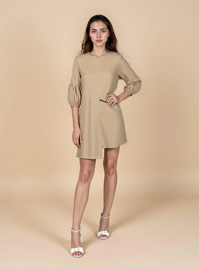 Chic — model wearing the beige cotton A line zip dress with puff sleeve hem