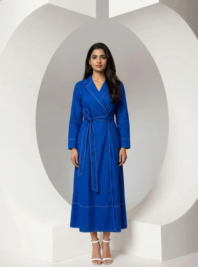 Fable — model wearing the electric blue signature collar maxi dress with double collar detailing and a fabric belt