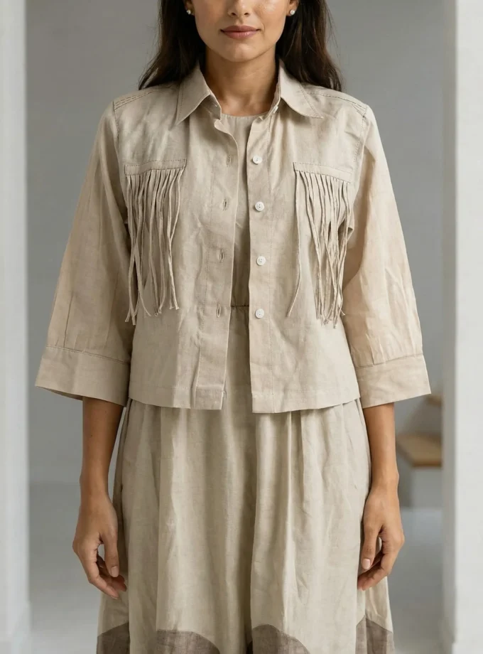 Inez — model wearing the light beige H-LOOM dress with brown scallop hem together with the tassel pocket crop shirt