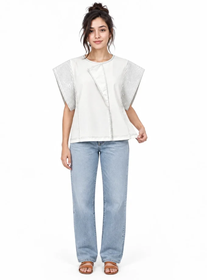 Isadora - model wearing the white denim cotton oversized sleeve flap top