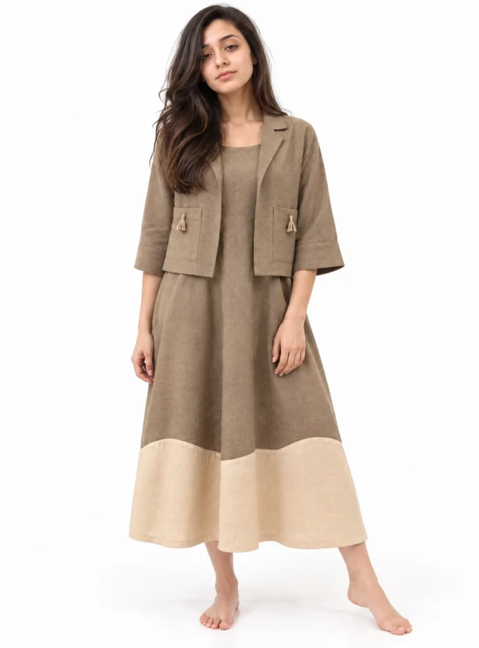 Juno — model wearing the brown H-LOOM co-ord, crop shirt with tassel pockets over the brown dress with beige scallop hem