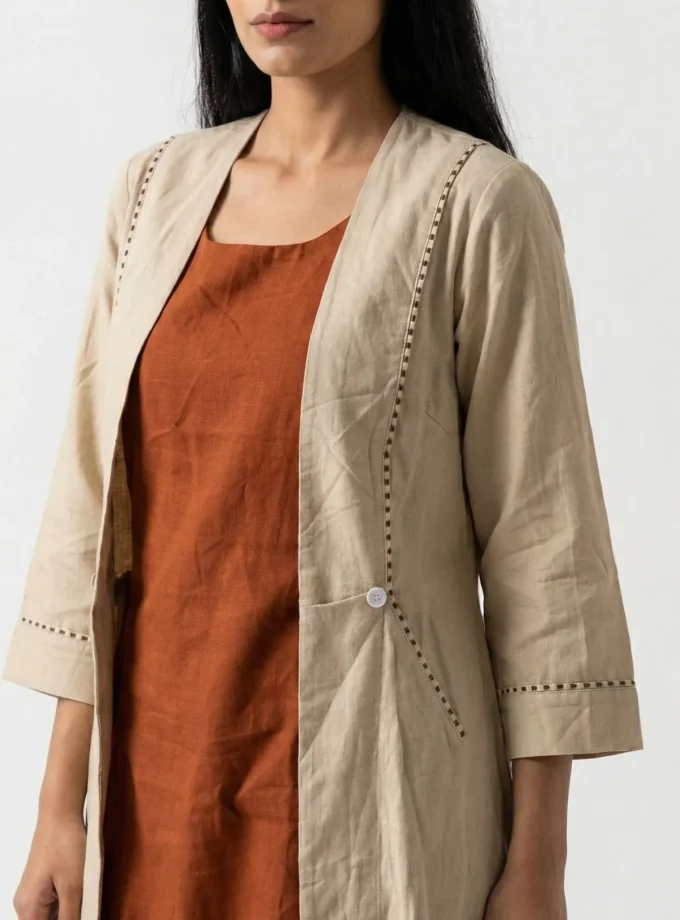 Lilah — model wearing the light beige h-loom flap collar open jacket over the rust h-loom sleeveless slip dress