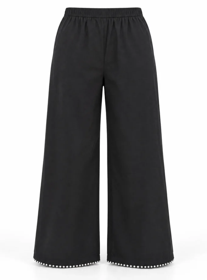 Lyra trousers - black cotton wide-leg pants with lace trim at the hem