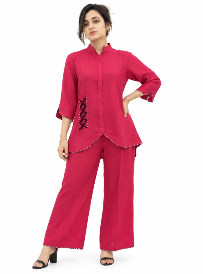 Mira co-ord set - pink cotton mandarin collar top with black lace-up detail and matching wide-leg trousers