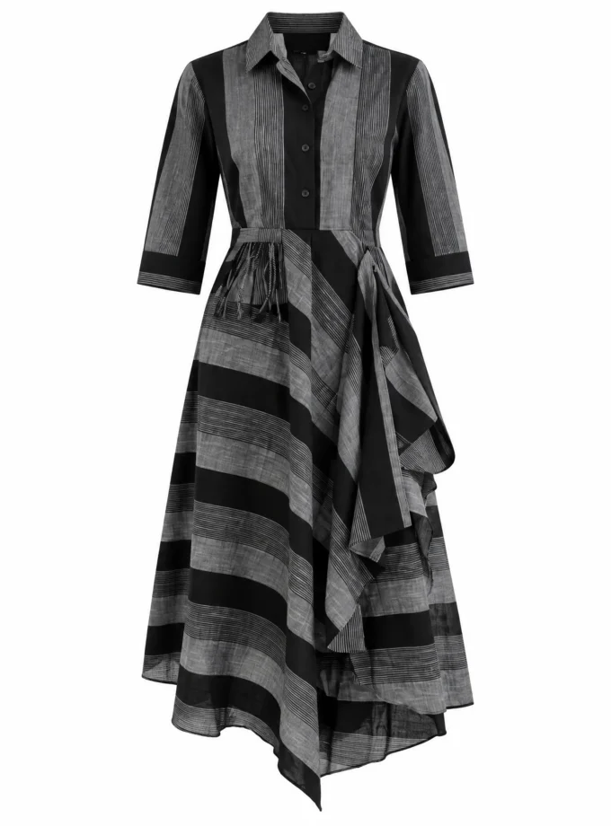 Naomi black and grey stripe loom cowl dress with tassel detailing shown alone on an invisible mannequin
