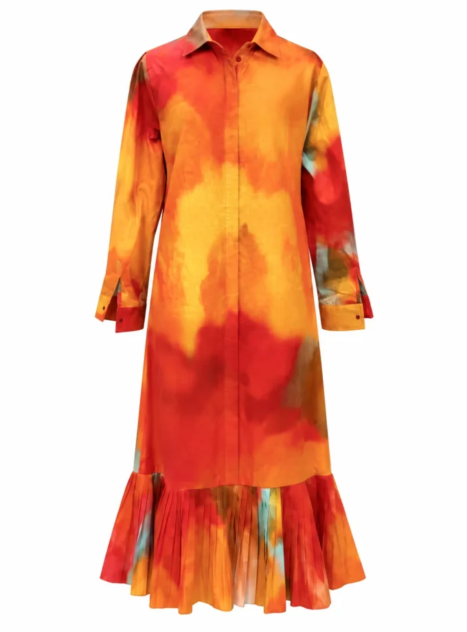 Naya watercolour printed maxi shirt dress alone on an invisible mannequin, with a pleated flared hem