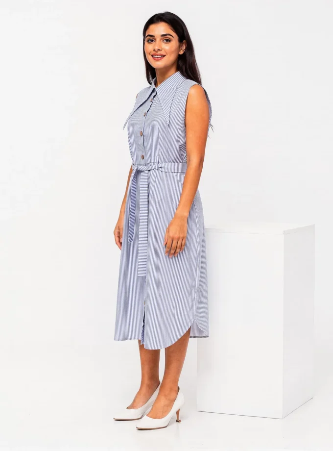 Rhea dress front — model wearing the blue and white striped long collar midi dress with self-tie belt