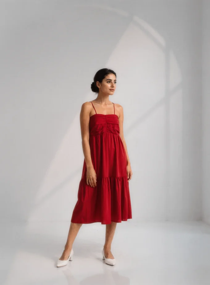 Sabine — model wearing the hot red ruched singlet dress with soft gathered layers