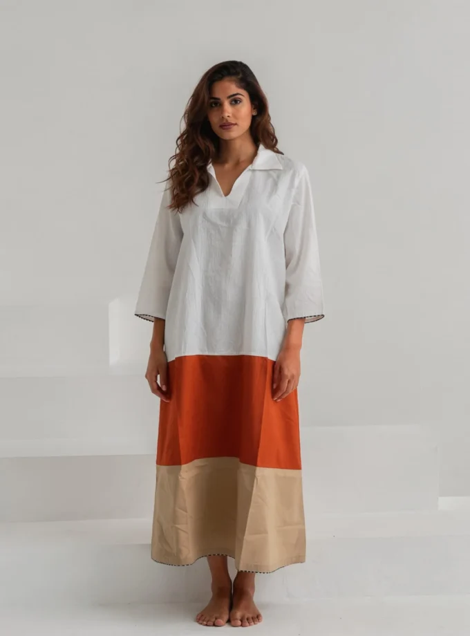 Solstice — model wearing the tri colour cotton A line dress with a collar neck and black and white hem finish