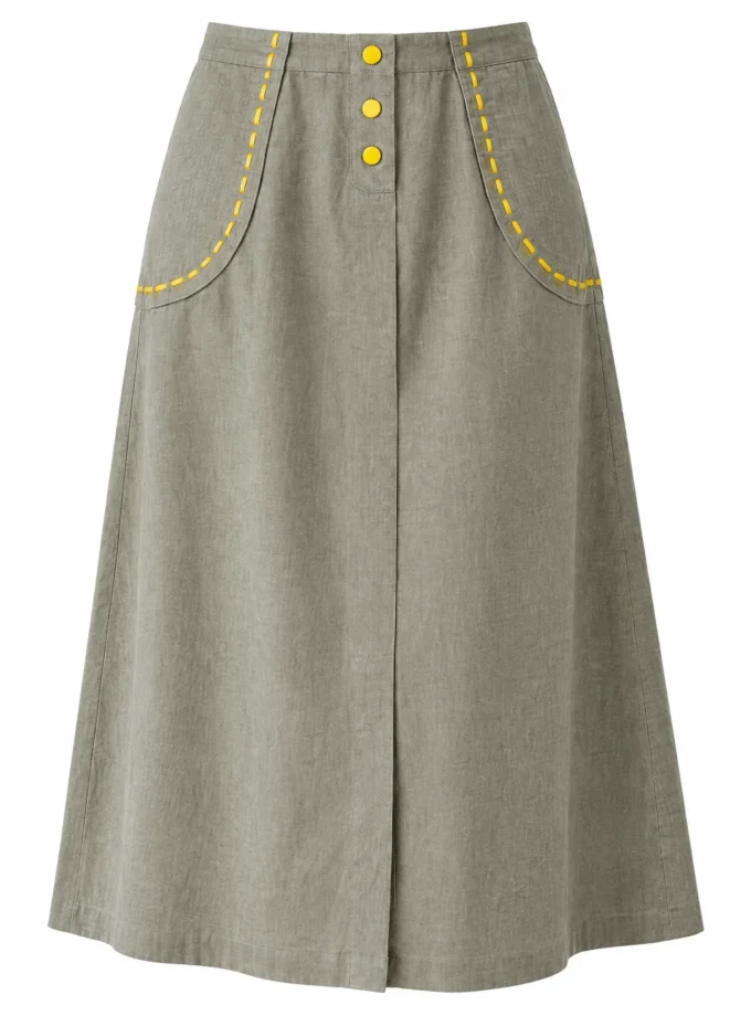 Sora chalk grey A-line skirt shown alone on an invisible mannequin, with yellow stitch detailing on the pockets and hem