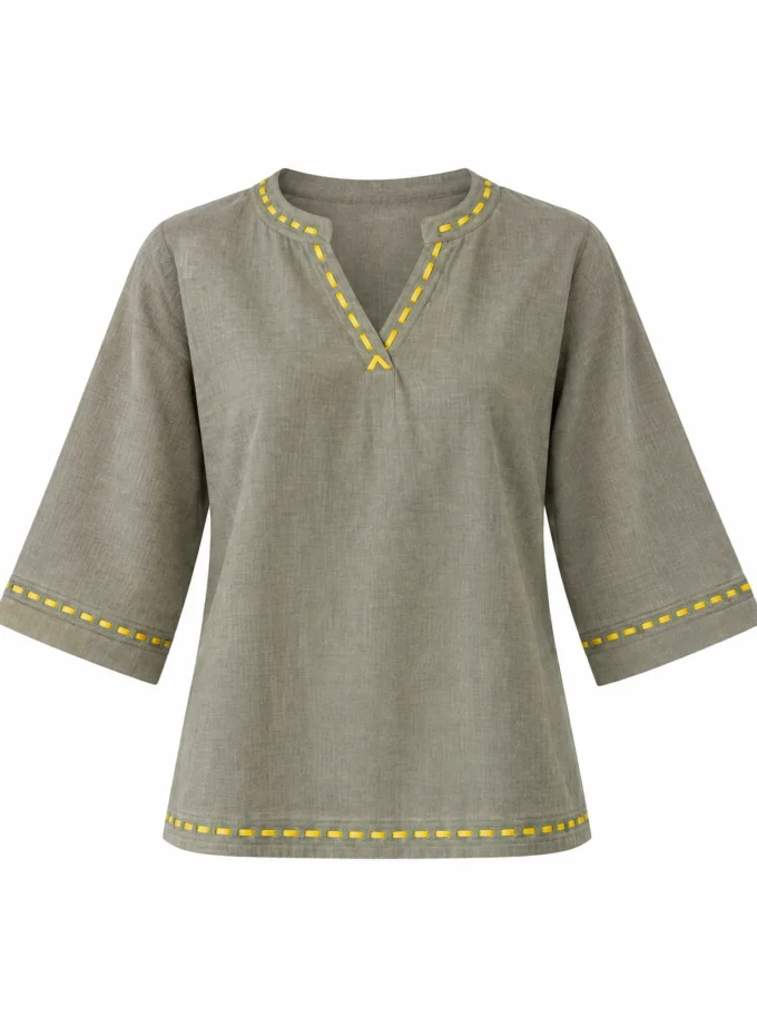 Sora chalk grey V neck top shown alone on an invisible mannequin, with yellow stitch detailing on the neckline, cuffs and hem
