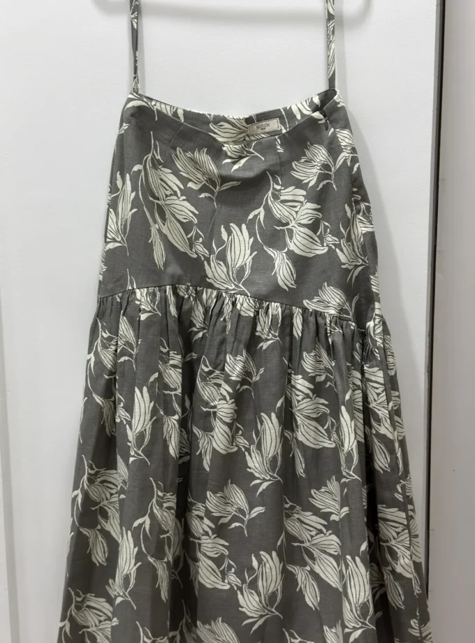 Stone grey floral printed corset yoke gathered skirt shown alone on a hanger