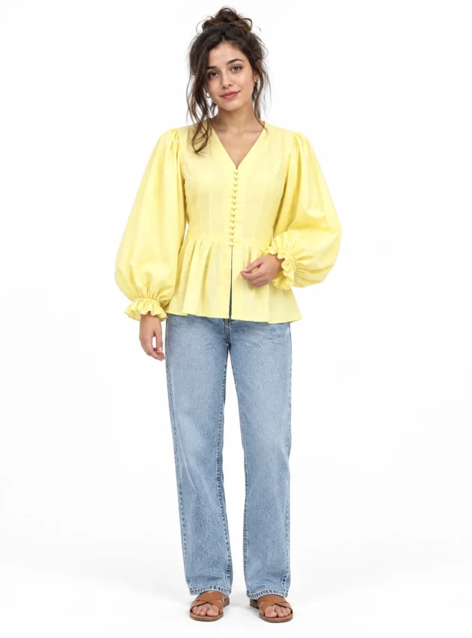 Tansy — model wearing the yellow linen cinched waist bat sleeve top with V neck