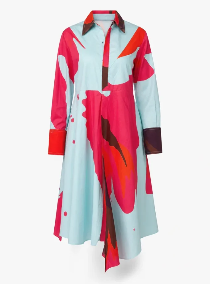 Terra sky print glaze cotton asymmetric dress with a low waist corset belt shown alone on an invisible mannequin