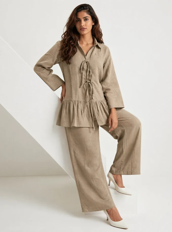 Valeria — model wearing the brown h-loom tie up top with a gathered hem paired with the brown h-loom straight fit pants