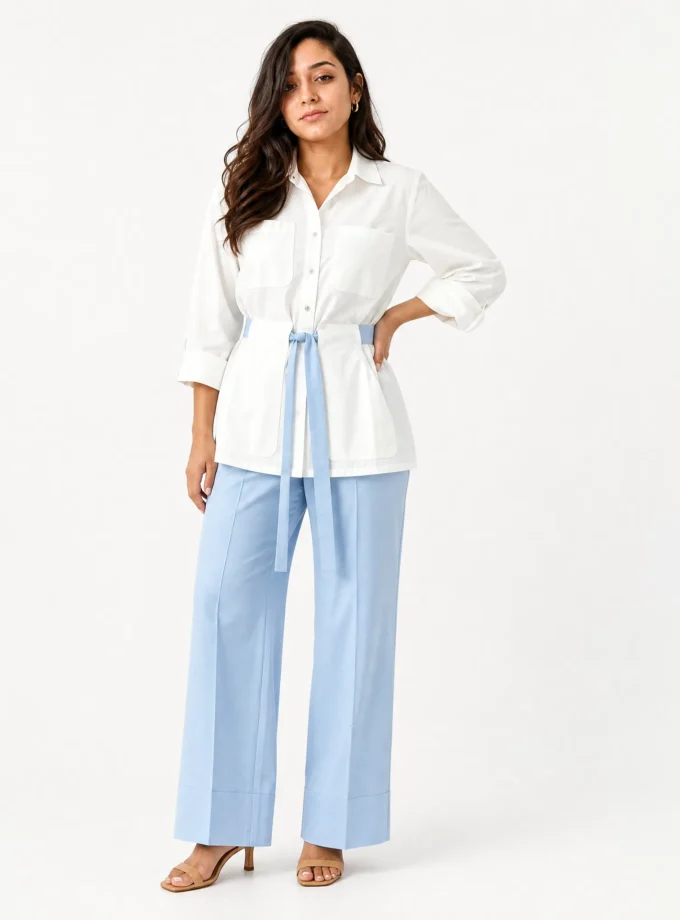 Valentina — model wearing the white cotton low collar shirt with blue belt and the powder blue cotton straight pants