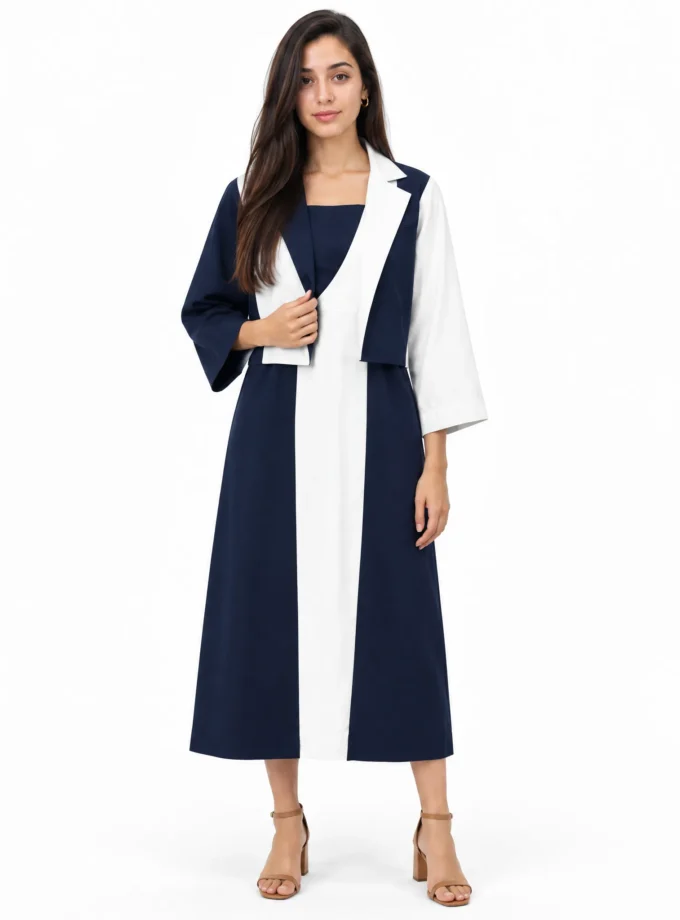 Vanya — model wearing the navy and white cotton division sleeveless dress with the navy and white cotton division jacket crop