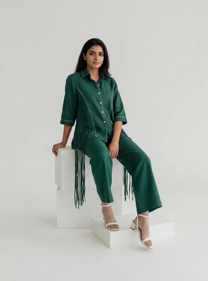 Xenia — model wearing the green denim tassel drop shirt with upturn sleeves paired with the green denim straight fit pant