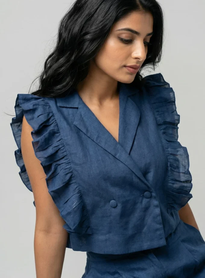 Zara — model wearing the teal h-loom ruffle crop top with flaps and matching teal h-loom shorts