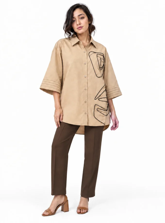 BEIGE COTTON ROSE SHIRT WITH ROSE APPLIQUÉ AND SLEEVE DETAILING, worn by a model