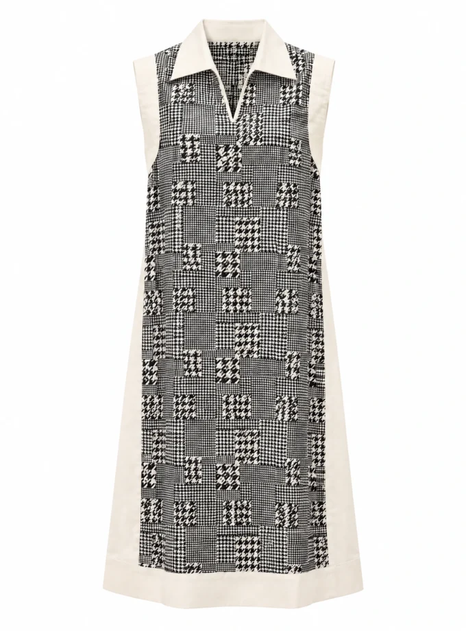 Calyra houndstooth print cotton faux dual dress with white cotton frame, sleeveless, shown alone on an invisible mannequin