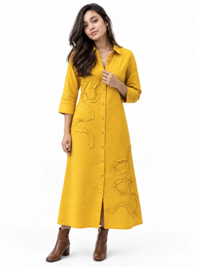Evarine mango H-loom shirt-collar aline dress with pleated applique placement, worn by a model